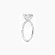 Round-cut moissanite hidden halo ring with pavé band in white gold vermeil, side view.