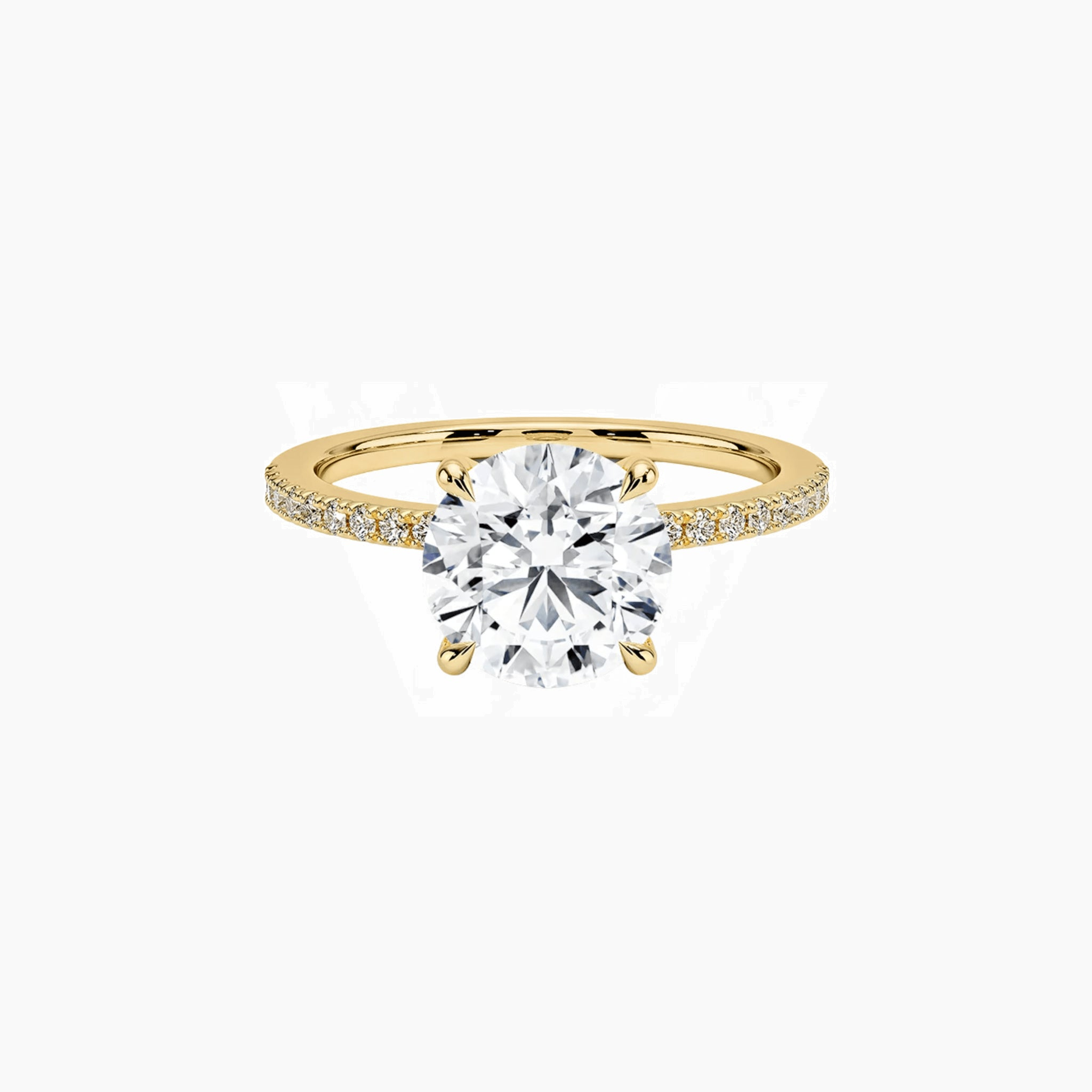 Round-cut moissanite hidden halo ring with pavé band in yellow gold vermeil, front view.