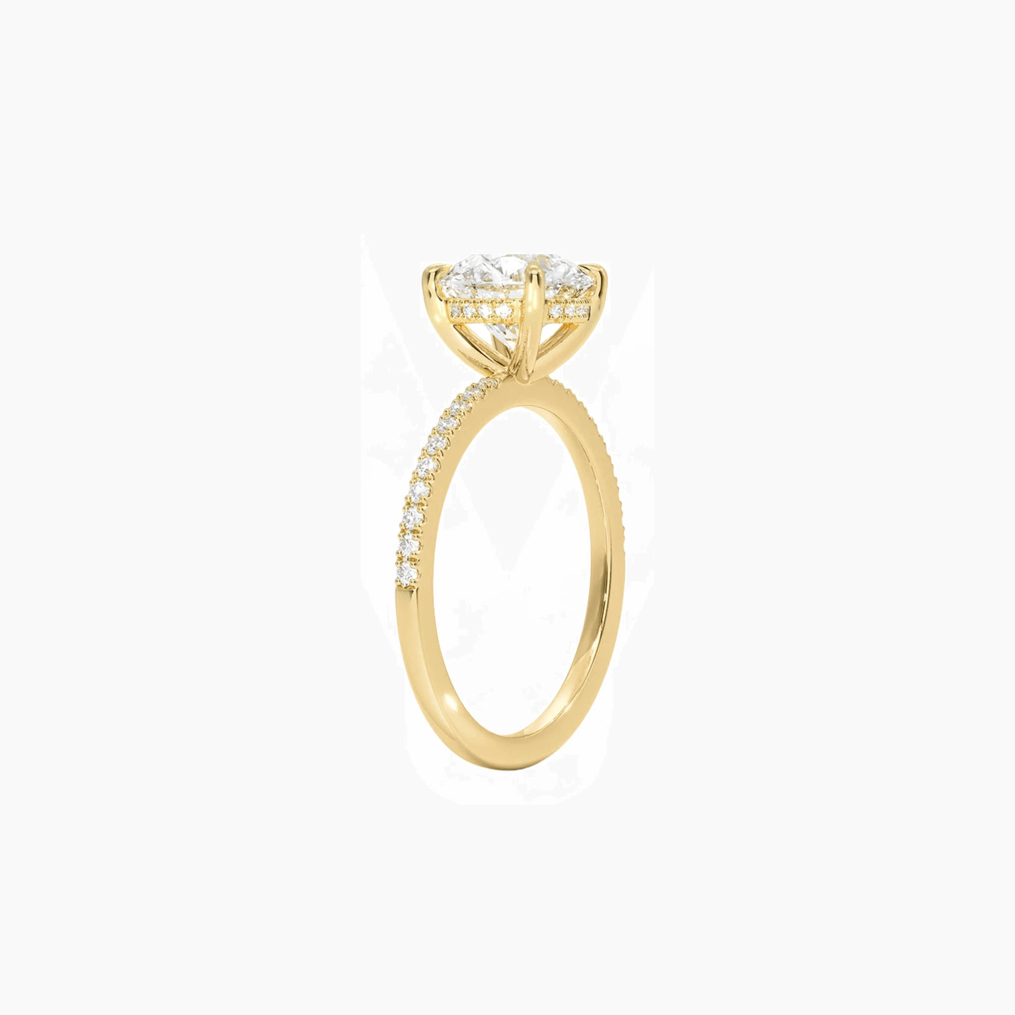 Round-cut moissanite hidden halo ring with pavé band in yellow gold vermeil, side view.