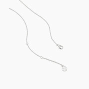 Round-cut moissanite pendant necklace in white gold vermeil, clasp and chain-end detail.