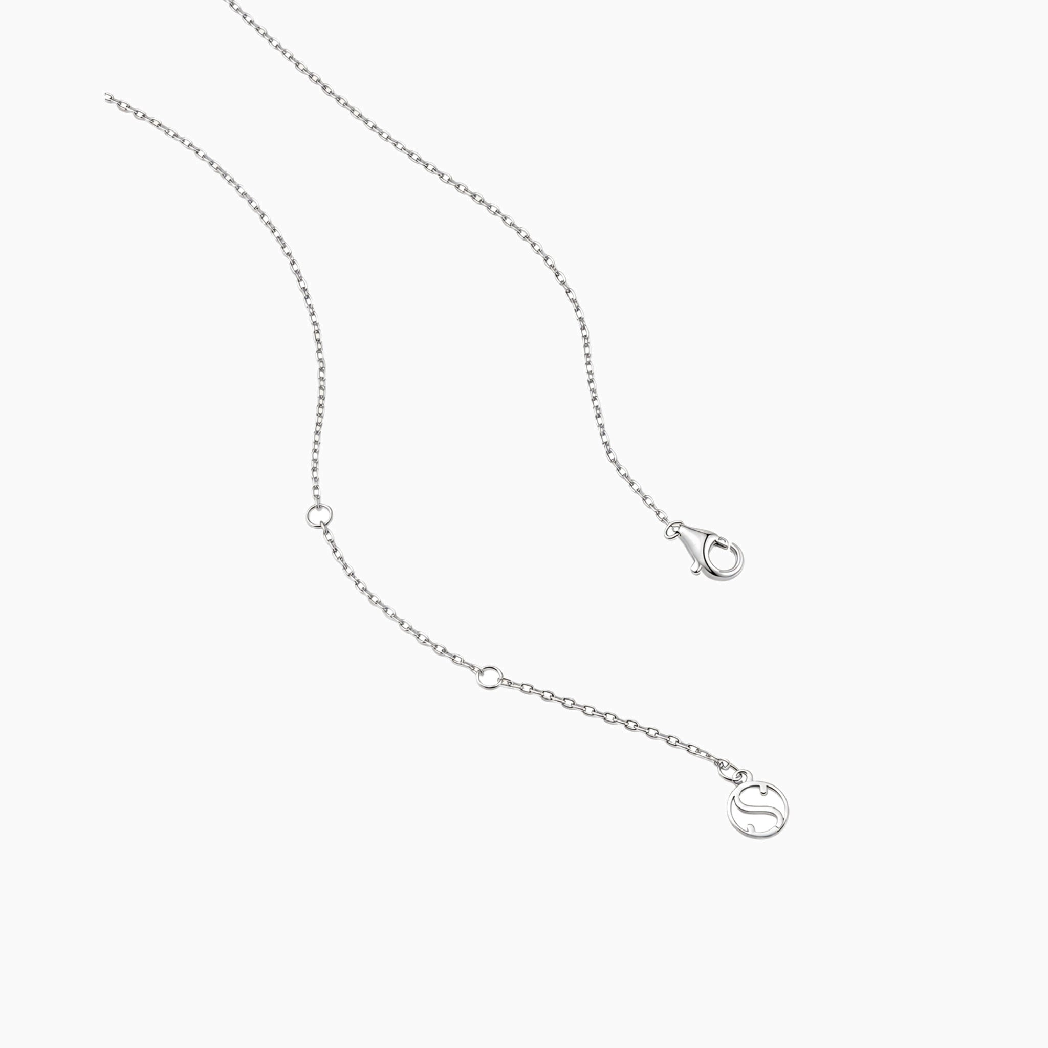 Round-cut moissanite pendant necklace in white gold vermeil, clasp and chain-end detail.