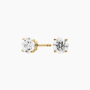 Round-cut moissanite stud earrings in yellow gold vermeil, front and side views.