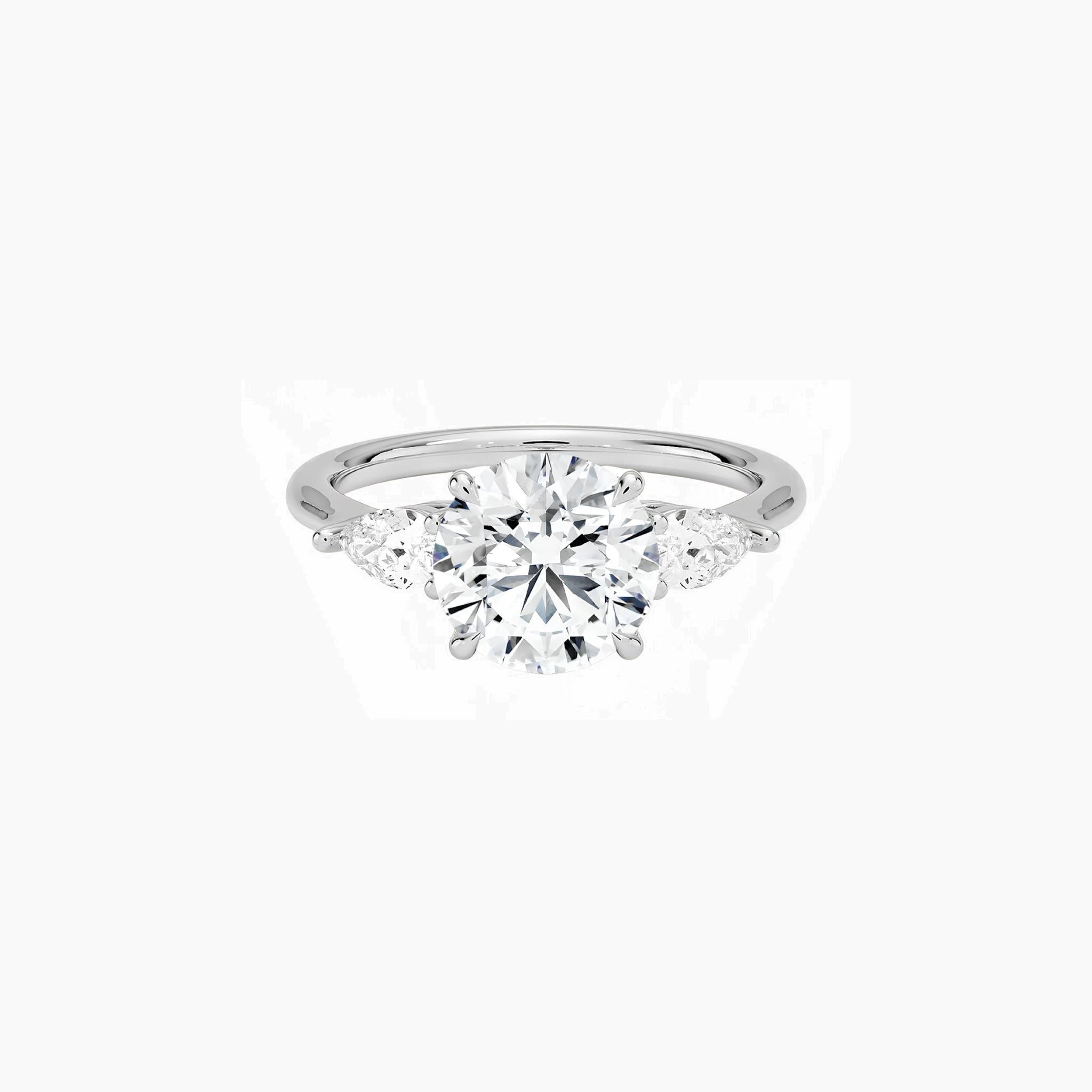 Round-cut moissanite three-stone ring in white gold vermeil, front view.