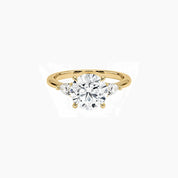 Round-cut moissanite three-stone ring in yellow gold vermeil, front view.