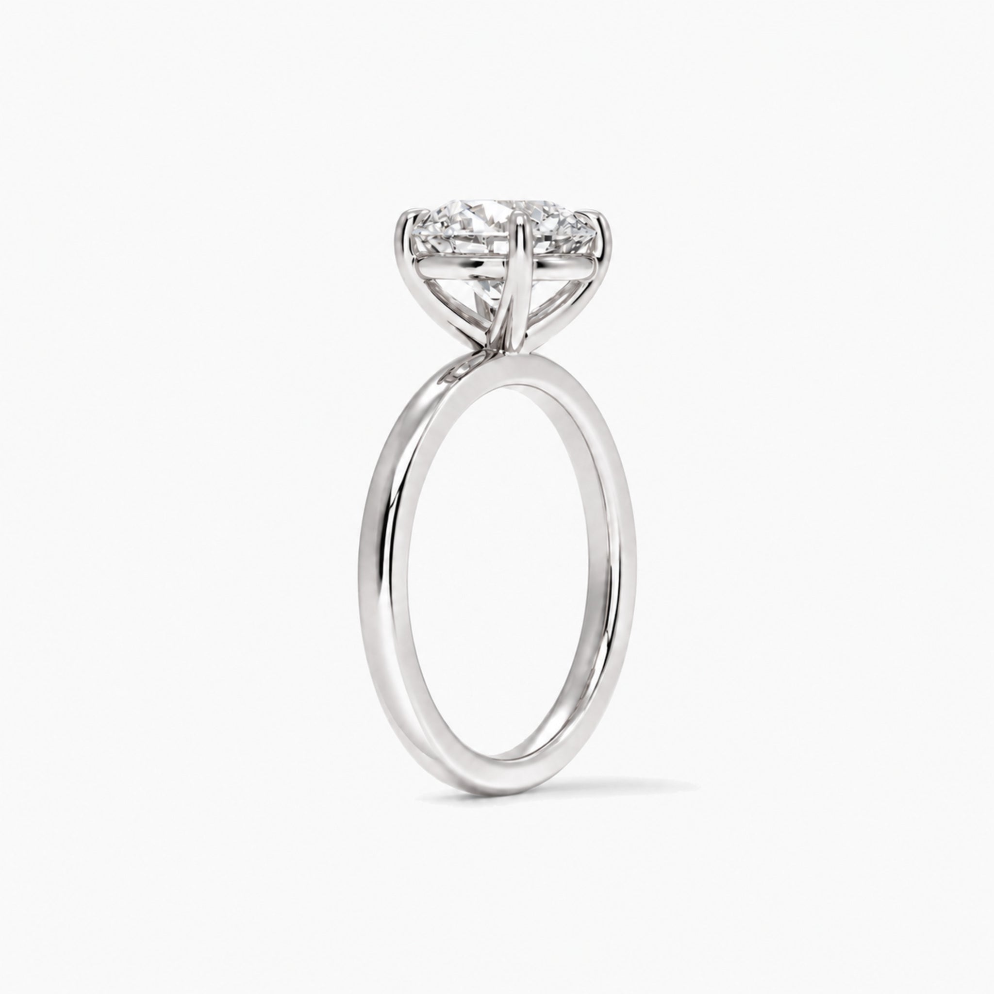 Round-cut moissanite solitaire ring in white gold vermeil, side view