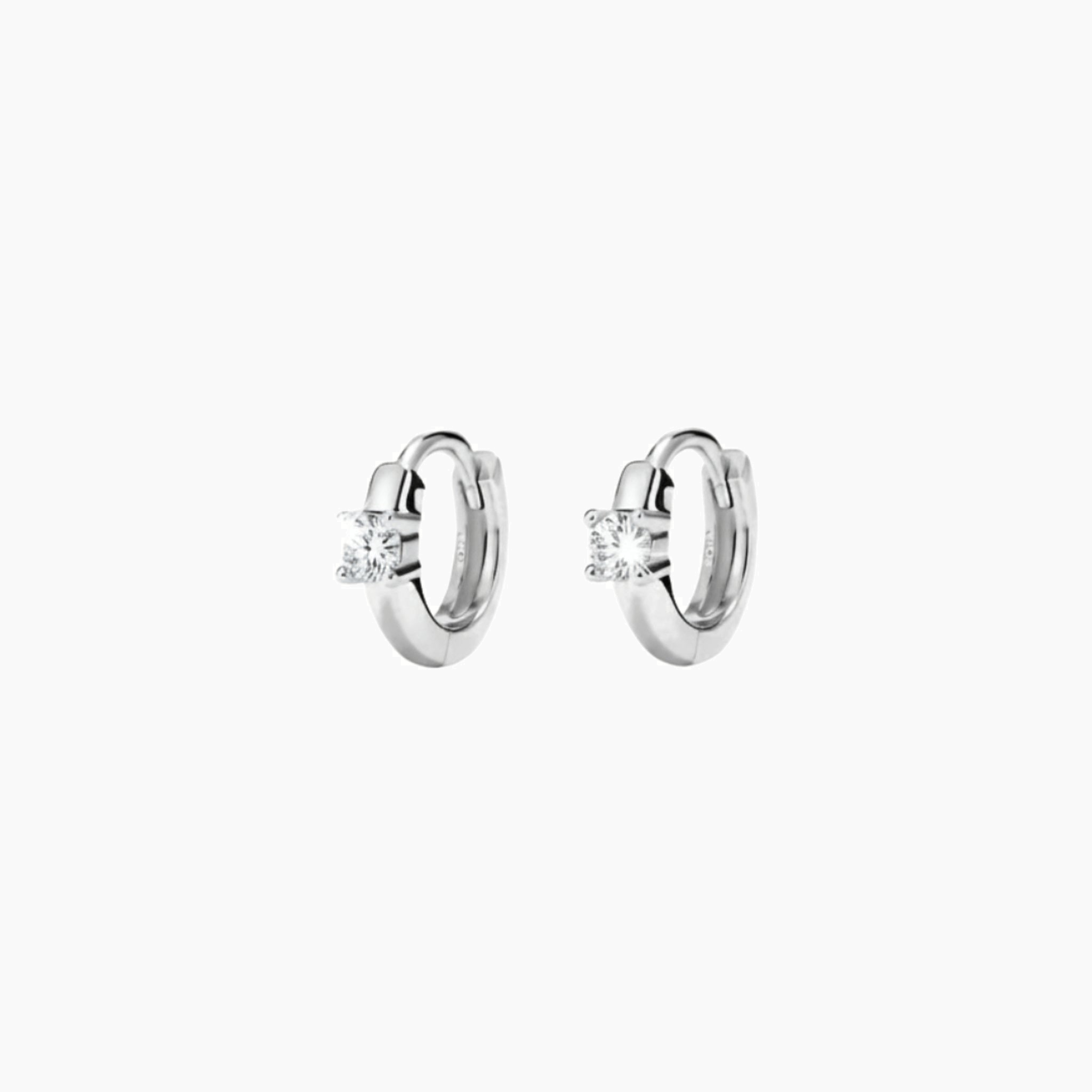 Single-stone moissanite huggie hoop earrings in white gold vermeil, front and side views.