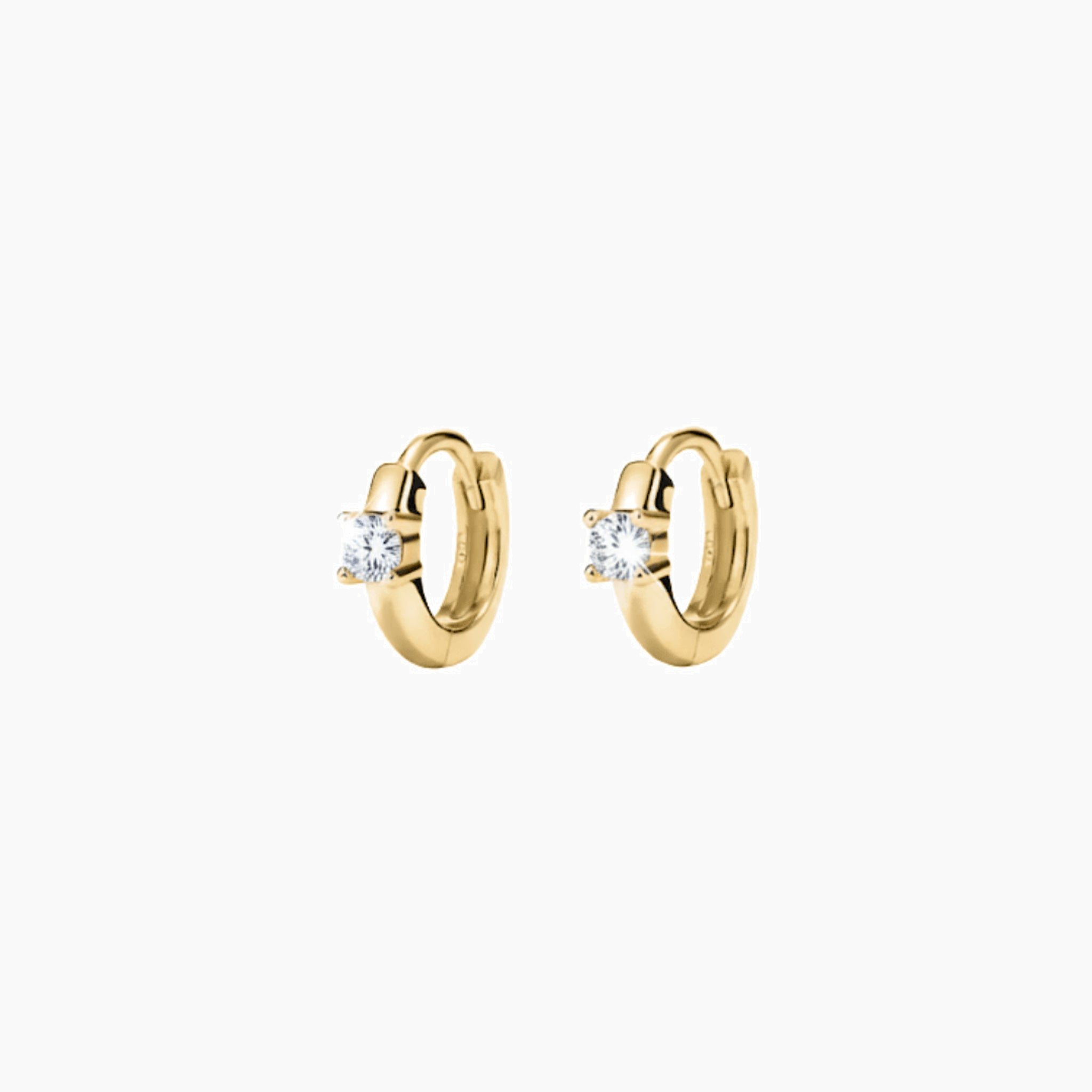 Single-stone moissanite huggie hoop earrings in yellow gold vermeil, front and side views.