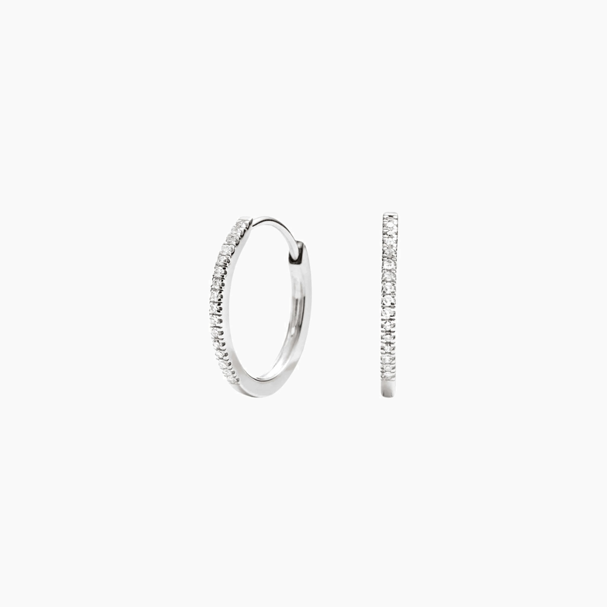 Small pavé moissanite hoop earrings in white gold vermeil, front and side views.